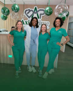 4 member os axis prime posing inside the medical clinic